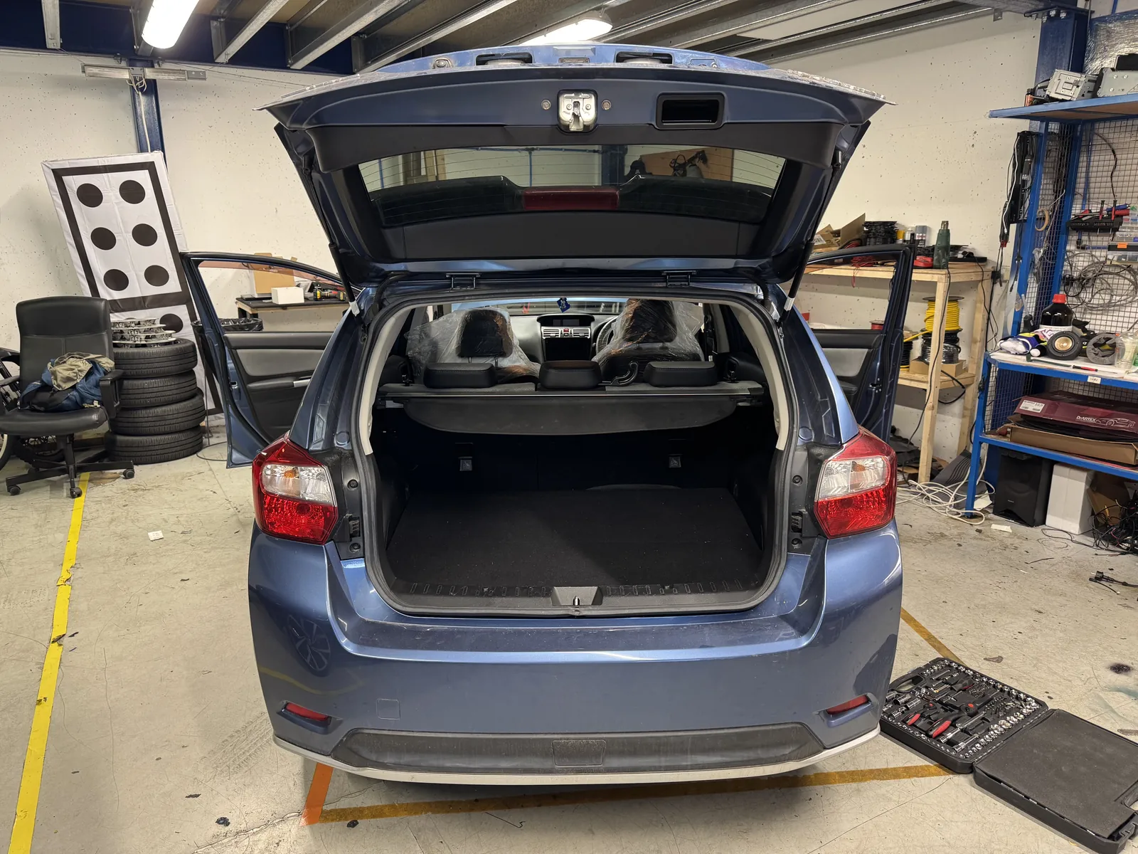 Subaru Impreza boot open during custom audio installation