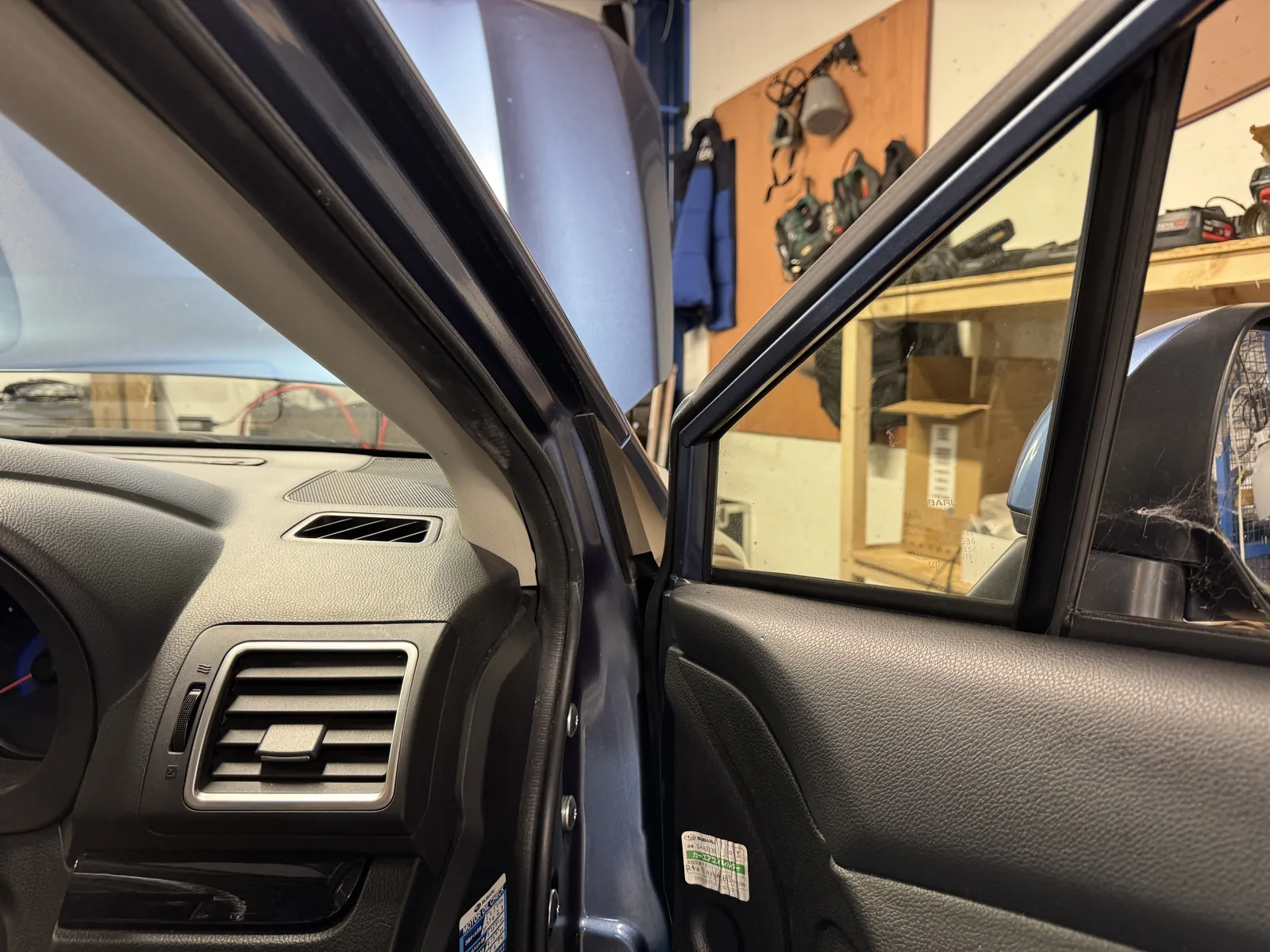 Subaru Impreza front door corner area during custom speaker installation