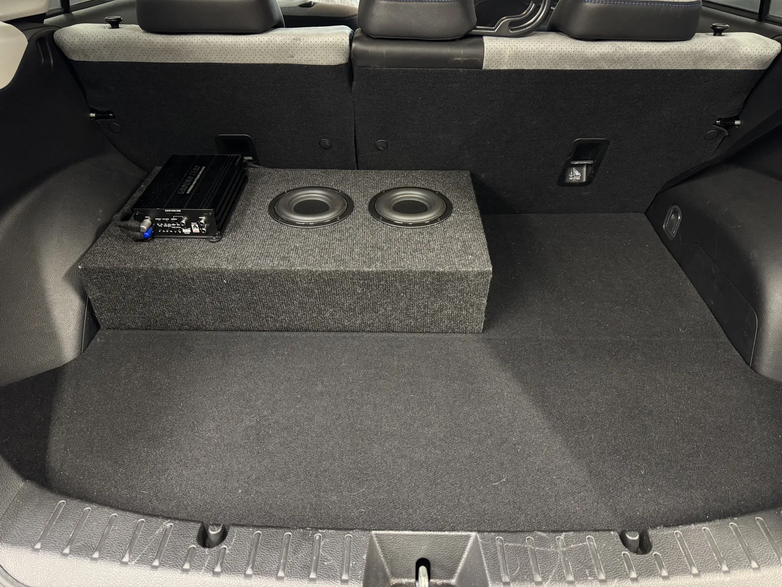 Ground Zero amplifier and dual subwoofer installation in Subaru Impreza boot
